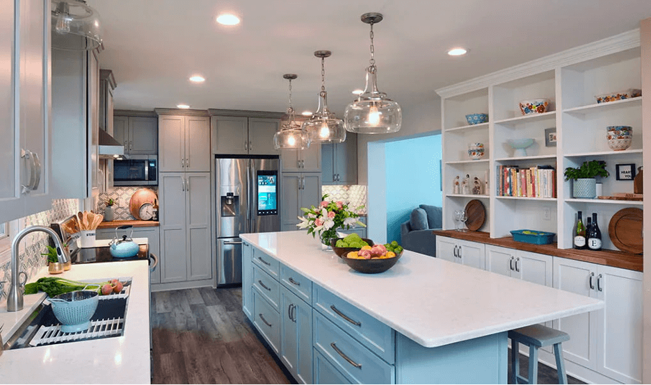 A newly remodeled kitchen featuring a large island and open shelving with fresh fruits.